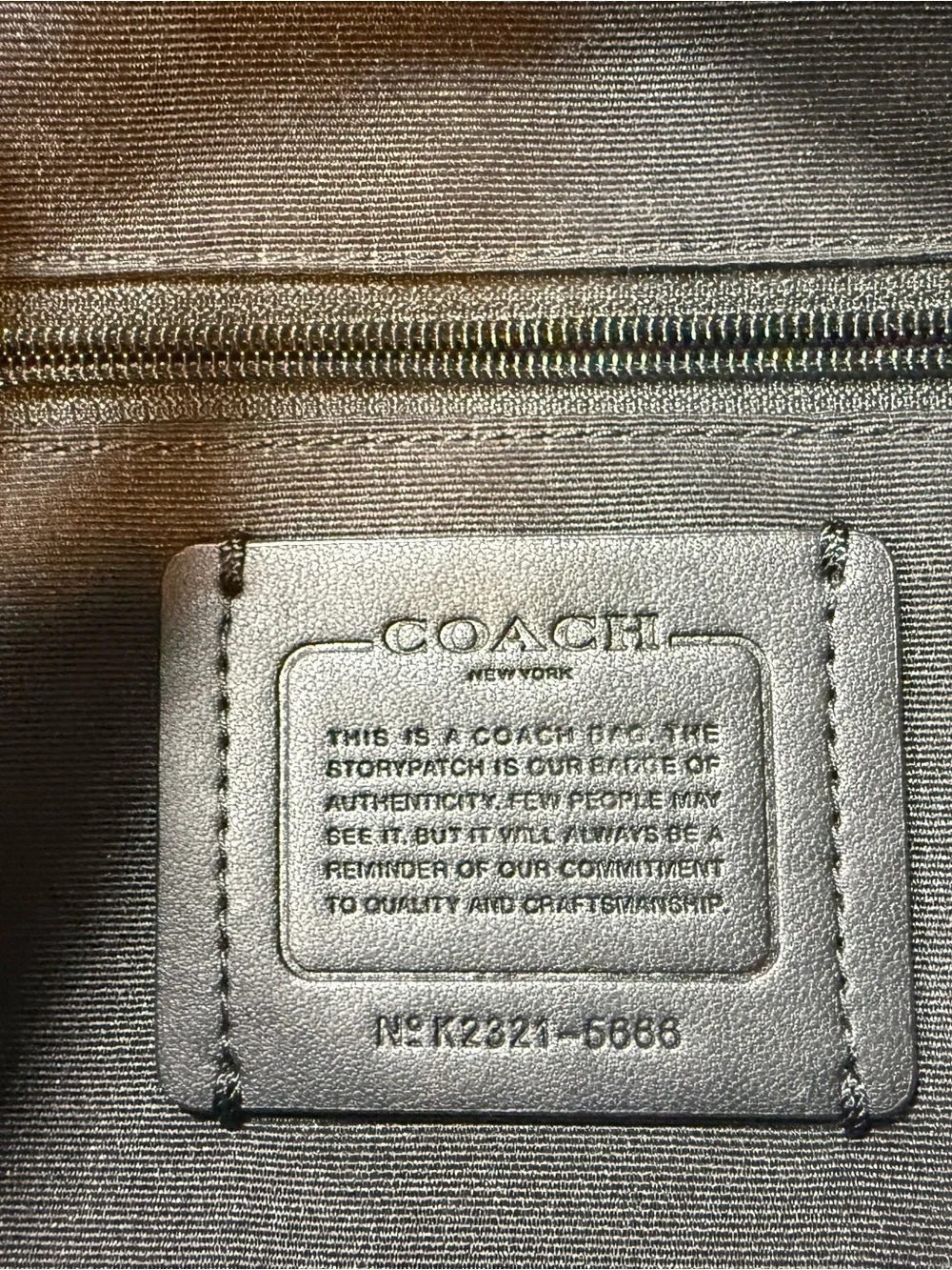 Coach compact pebbled